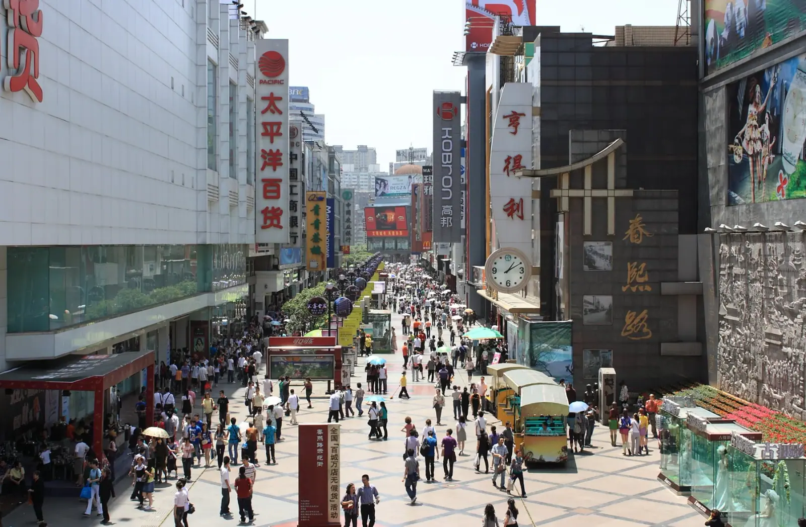 Busy Chunxi Road pedestrian area and high-rise city streets in Chengdu