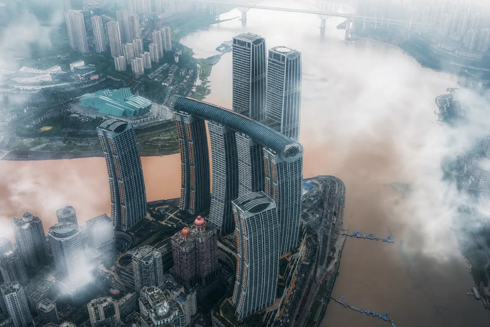 Aerial view of Raffles City Chongqing towers and the Crystal skybridge at Chaotianmen